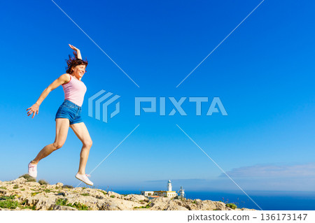 Woman enjoy trip in Spain. Mesa Roldan lighthouse location, Almeria Spain. Woman enjoy trip in Spain. Mesa Roldan lighthouse location, Almeria Spain. 136173147