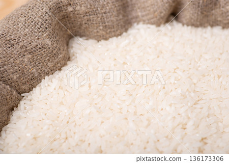 Rice in sack. Grain of rice after harvest 136173306
