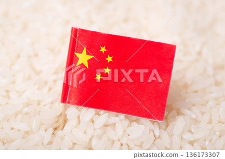 Flag of China on grain of rice. Concept of growing rice in China 136173307