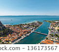 Aerial view of Omis town Croatia with Cetina river mouth marina boats and Adriatic Sea 136173567