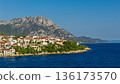 Summer coastal landscape of Makarska Riviera with village by the sea and dramatic mountain scenery aerial view 136173570