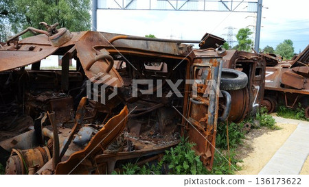 Rusty and burned-out armored vehicles on ukrainian territory. Exhibition of destroyed military equipment of the russian army. War between Ukraine and russia. Close up Slow motion Rusty and burned-out armored vehicles on ukrainian territory. Exhibition of destroyed military equipment of the russian army. War between Ukraine and russia. Close up Slow motion 136173622