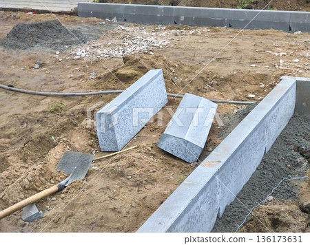 Construction road.Roadbed with border stone prepared for asphalt laying 136173631