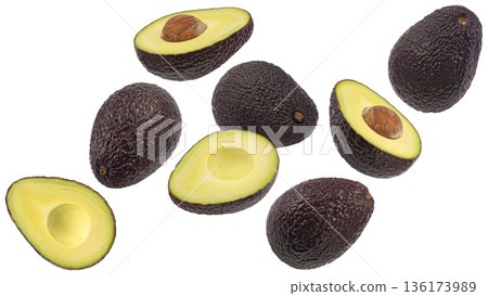 Whole and sliced avocado isolated on white background with clipping path, full depth of field Whole and sliced avocado isolated on white background with clipping path, full depth of field 136173989