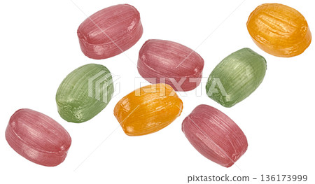 Falling colorful bonbons candy assortment isolated on white background, full depth of field Falling colorful bonbons candy assortment isolated on white background, full depth of field 136173999