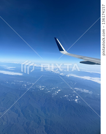 Airplane Wing Above Clouds 136174157