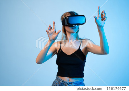 Young woman engineer working with VR headset, immersive high technology experience and innovation in digital engineering Young woman engineer working with VR headset, immersive high technology experience and innovation in digital engineering 136174677