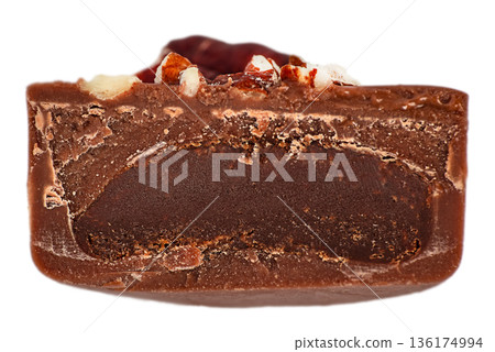 Chocolate candy cross section with rich dark filling isolated on white 136174994
