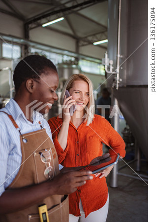 Women brewing business partners using technology in modern brewery Women brewing business partners using technology in modern brewery 136175094