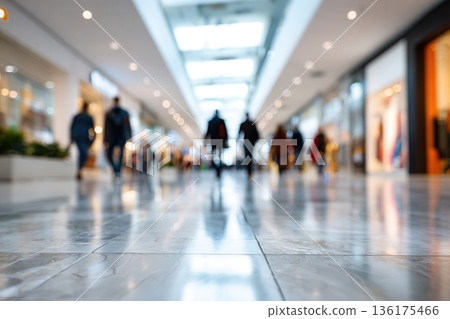 Shoppers walking through mall corridor Shoppers walking through mall corridor 136175466