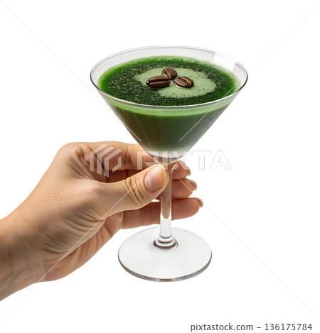 Hand holding elegant, vibrant green cocktail garnished with coffee beans, perfect for sophisticated nightlife, unique mixology, and modern bars Hand holding elegant, vibrant green cocktail garnished with coffee beans, perfect for sophisticated nightlife, unique mixology, and modern bars 136175784