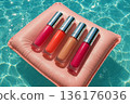 Colorful Lip Gloss Set Floating on Pool Water Background 136176036