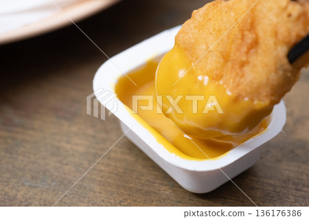 Image of chicken nuggets and mustard sauce Image of chicken nuggets and mustard sauce 136176386