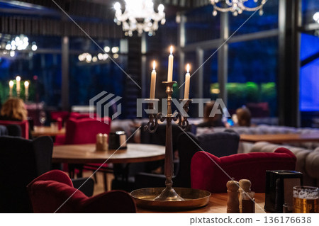 Elegant Restaurant Interior with Candlelight and Cozy Evening Atmosphere 136176638
