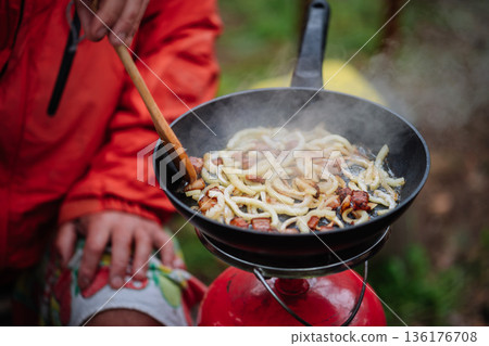 Outdoor Cooking Lard and Onion on Camping Stove Outdoor Cooking Lard and Onion on Camping Stove 136176708
