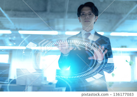 Man operating futuristic technology 136177083