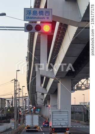 Metropolitan Expressway and trucks running under the overpass Metropolitan Expressway and trucks running under the overpass 136177178