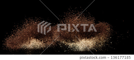Roasted Coffee powder ground dust splash explosion in mid Air. Ground Coffee roasted powder dust fly explosion, Coffee crushed ground float pouring. Black background Isolated Roasted Coffee powder ground dust splash explosion in mid Air. Ground Coffee roasted powder dust fly explosion, Coffee crushed ground float pouring. Black background Isolated 136177185
