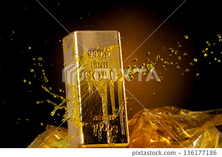 Melting Gold Bar Flowing into Liquid spray wealth prosperity. Gold bar standard is bank reserve to finance economic, golden liquid water splash as price up down. Black background isolated Melting Gold Bar Flowing into Liquid spray wealth prosperity. Gold bar standard is bank reserve to finance economic, golden liquid water splash as price up down. Black background isolated 136177186