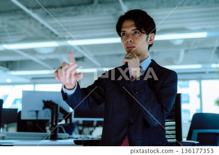 Businessman manipulating the future Businessman manipulating the future 136177353