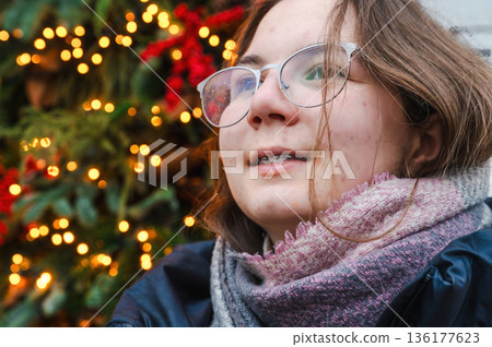 Cheerful Christmas Girl with Festive Lights Cheerful Christmas Girl with Festive Lights 136177623