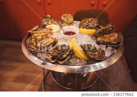 Fresh Raw Oysters with Citron, Baguette, Butter, and Cider Fresh Raw Oysters with Citron, Baguette, Butter, and Cider 136177662