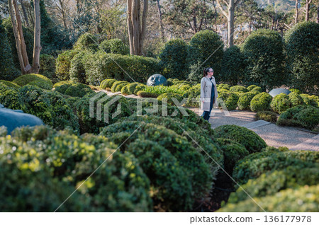 Woman in Jardins d'Etretat 136177978