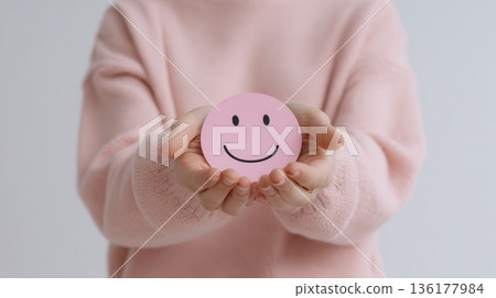 person holding pink face 136177984