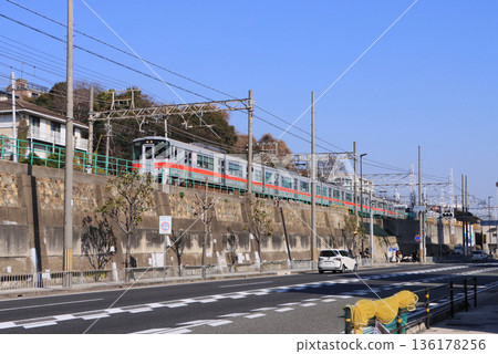 Sanyo Electric Railway 5000 series direct express train running near Sanyo Suma Station 136178256