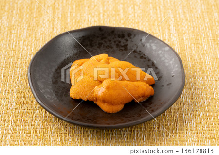Delicious raw sea urchin served on a plate Delicious raw sea urchin served on a plate 136178813