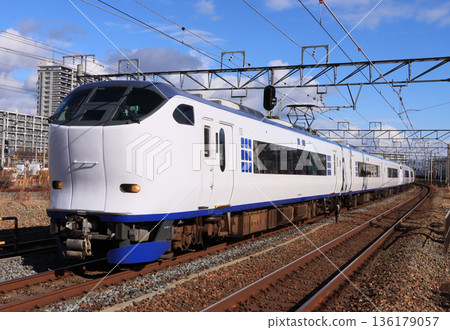 Limited express Haruka passing through Kishibe station 136179057