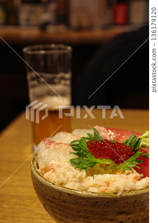 Enjoying seafood bowl and beer at an izakaya in Atami (vertical) Enjoying seafood bowl and beer at an izakaya in Atami (vertical) 136179120