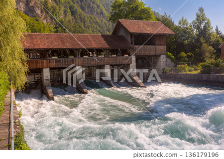 Historic wooden weir on the Aare River in Interlaken, Switzerland Historic wooden weir on the Aare River in Interlaken, Switzerland 136179196