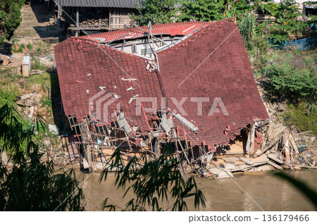 Local houses in Karen village elephant camp in Mae Yao district destroyed after Typhoon Yagi has swept Chiang Rai province of Thailand. Local houses in Karen village elephant camp in Mae Yao district destroyed after Typhoon Yagi has swept Chiang Rai province of Thailand. 136179466
