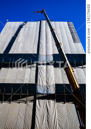 Cranes and blue sky of a building under construction a-2 High saturation contrast 136179488