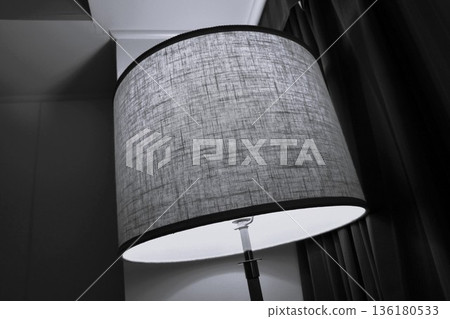 A calm monochrome photo of a room with the texture of a fabric lampshade that emits soft light A calm monochrome photo of a room with the texture of a fabric lampshade that emits soft light 136180533