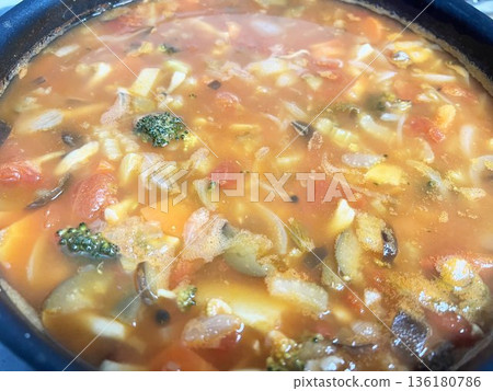 Minestrone soup boiling in a pot Minestrone soup boiling in a pot 136180786
