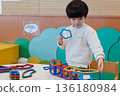 Boy playing with educational toys 136180984