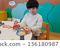 Boy playing with educational toys 136180987