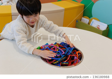 Boy playing with educational toys Boy playing with educational toys 136180988