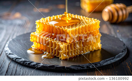 Honeycomb with Fresh Honey on Plate 136180992