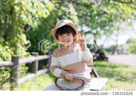 Boy playing with seesaw 136181026