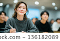 A young Japanese female employee shows a positive attitude at the seminar 136182089