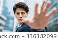 A Japanese businessman asking for restraint in the city lights 136182099