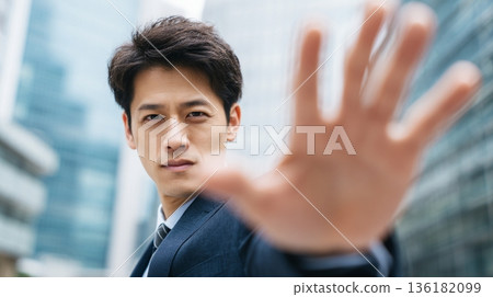 A Japanese businessman asking for restraint in the city lights 136182099