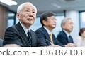 Senior Japanese men listening to a lecture at a lifelong learning center 136182103