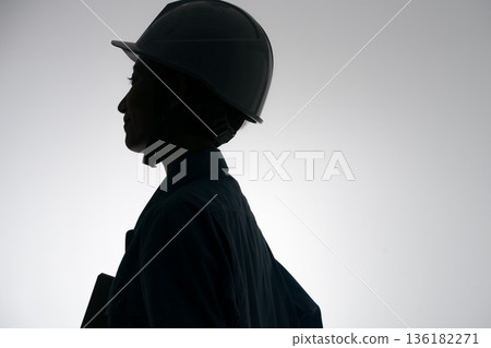 Silhouette of a woman in work clothes 136182271