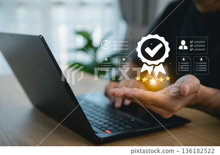 Man holding virtual quality assurance icon and five stars for premium service. Concept of customer satisfaction, business excellence, top rating, guarantee, and positive feedback 136182522