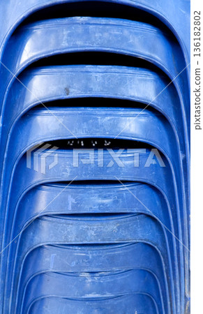 orange, plastic, chair, stack, stacked, furniture, texture, weathered, scratched, used, pattern, curve, layer, repetition, event, rental, equipment, material, synthetic, bright, detail, surface, mass- 136182802