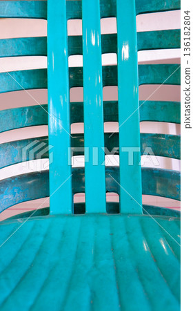 Close-up Detail of Cyan Plastic Chair Backrest Texture 136182804